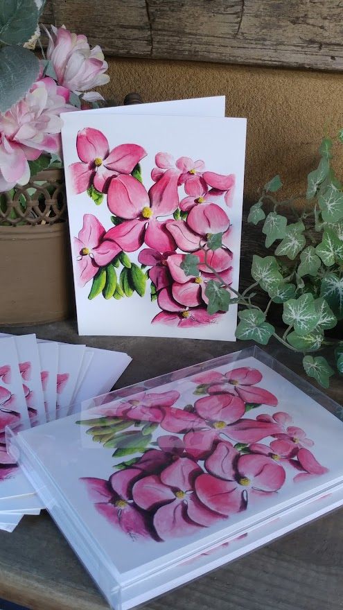 Dogwood greeting cards stacked and standing, printed from the original painting.